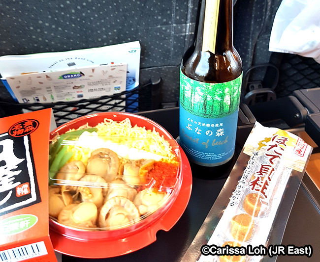Eating ekiben on the train. (Image credit: JR East / Carissa Loh)